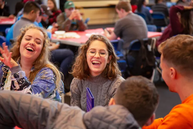 TUS international student laughing with friends.